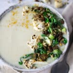 Cauliflower vegan soup with beans and curried seeds!